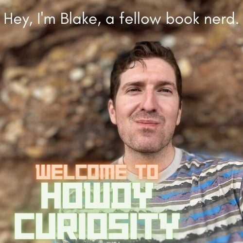 the shop owner sitting in front of a rock face with the text Hey, I'm Blake, a fellow book nerd. Welcome to Howdy Curiosity. 